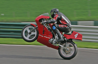 Mike Hose wheelies over the Mountain at Cadwell Park - © Tony Roberts